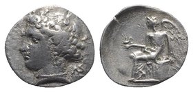 Bruttium, Terina, c. 300 BC. AR Drachm (16mm, 2.01g, 1h). Head of the nymph Terina l.; triskeles behind neck. R/ Nike seated l. on plinth, holding out...