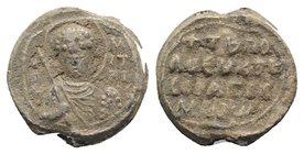 Byzantine Pb Seal, c. 7th-12th century (17mm, 6.24g, 12h). Facing bust of Saint, holding spear and shield. R/ Legend in four lines. VF