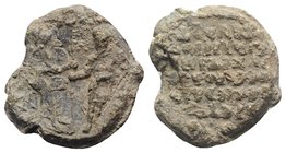 Byzantine PB Seal, c. 11th-13th century (28mm, 18.31g, 6h). Two figure standing facing, holding labarum between them. R/ Legend in seven lines. Near V...