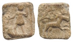 Roman PB Tessera, c. 1st century BC - 1st century AD (14mm, 2.03g, 12h). Diana standing l., holding bow and drawing arrow. R/ Stag running r.; tree to...