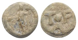 Roman Triangular PB Tessera, c. 1st century BC - 1st century AD (8.5mm, 0.83g, 6h). Jupiter(?) standing l., holding patera and sceptre. R/ T-F/A with ...