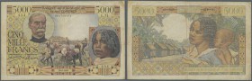 Madagascar: 5000 Francs 1950, P. 49a with a number of pinholes at left, several folds and stains and tiny tears at lower margin and right border. Cond...