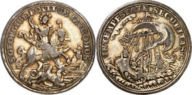 RELIGION UND ETHIK. 
HEILIGE. 
Georg. Halbtalerartige Medaille o.J. (18.Jh.) (o. Sign.) St. Georg zu Pferd ersticht den Drachen / Christus und 3 Apo...