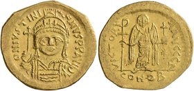 Justinian I, 527-565. Solidus (Gold, 21 mm, 4.21 g, 1 h), Constantinopolis, 545-565. D N IVSTINIANVS P P AVI Helmeted and cuirassed bust of Justinian ...