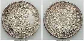 Leopold I Taler 1695 XF, Vienna mint, KM1275.4, Dav-3229A. 44.4mm. 28.34gm. Steel gray and gold toning, small flan defect before face. 

HID0980124201...