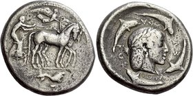 Syracuse
Decadrachm of the Demareteion series circa 465, AR 43.02 g. Slow quadriga driven r. by charioteer, wearing chiton, holding reins in both han...
