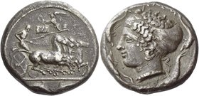 Syracuse
Tetradrachm signed by Eumenes and Euainetos circa 410, AR 16.84 g. Fast quadriga driven r. by charioteer holding reins and kentron. Above, N...