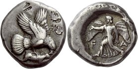 Elis, Olympia
Stater circa 450-440, 82nd-87th Olympiad, AR 12.38 g. Eagle flying r., grasping hare with its talons and tearing at it with its beak. R...