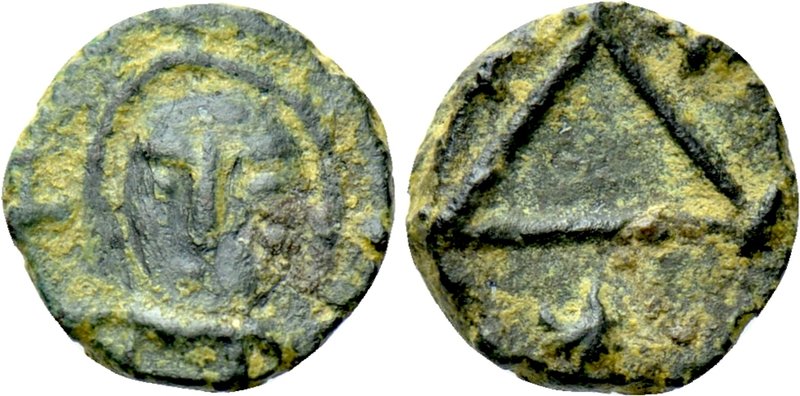 JUSTINIAN I (527-565). 1 Nummus. Carthage. 

Obv: Bust facing.
Rev: Large A b...