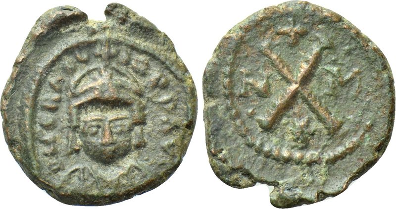 HERACLIUS (610-641). Decanummium. Carthage. 

Obv: Helmeted bust facing.
Rev:...