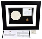 g Elizabeth II (1952-), gold Proof One Pound Coin, 2011, in presentation picture frame with plaster cast of the Cardiff reverse designed by Stuart Dev...