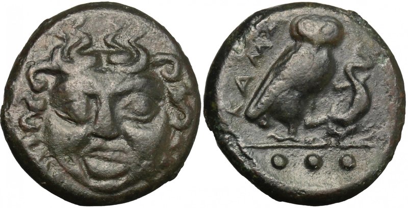 Sicily. Kamarina. AE Tetras, 425-405 BC. D/ Gorgoneion facing. R/ Owl standing r...