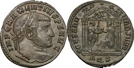 Maxentius (306-312). AE Follis, Aquileia mint, 307 Ad. D/ Head right, laureate. R/ Roma seated left in tetrastyle temple, giving globe to Maxentius st...