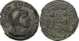 AE Barbaric imitation of a late Roman type, c. 4th century. D/ Head right, helmeted. R/ Two Victoriae holding shield over altar. AE. g. 2.80 mm. 18.00...