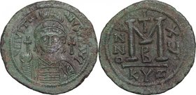 Justinian I (527-565). AE Follis, Cyzicus mint, 538-553. D/ Bust facing, helmeted, cuirassed, holding globus cruciger and shield. R/ Large M (mark of ...