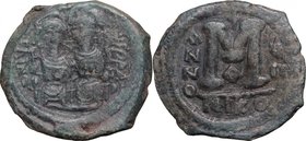 Justin II (565-578). AE Follis, Nicomedia mint, 572-573. D/ Emperor and his wife Sophia enthroned facing. R/ Large M (mark of value). MIB 46b. AE. g. ...