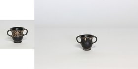 Greek miniature krater.
 A ceramic blackware miniature bell krater with flared rim and strap handles, both faces with red applied floral motifs.
 5t...
