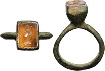 Orange calcedony intaglio ring, the bezel engraved with turreted head.
 Roman, 2nd-3nd century AD.
 Ring size: 16.5 mm. Tyche. Ex CNG 87, lot 2262.
