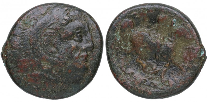 319-297 aC. Filipo III. AE 18. GC 6696. Ae. 5,68 g. Anv. Cabeza de Apolo a derec...