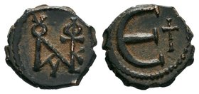Justin II AE decanummium, 565-578 AD. Constantinople mint. Justin II monogram (Sear type 8) / Large epsilon, officina letter to right. No mintmark. SB...