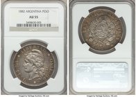 Republic Peso 1882 AU55 NGC, KM29. A handsome Latin American crown-type carefully overlaid with an array of silver tones. 

HID09801242017