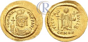 Byzantine. Maurice Tiberius. AV Solidus. 583-602.
Gold. 4,40g. Constantinople. Av: "DN MAVRC TIB PР AVG". Dr. and cuir. bust facing, wearing plumed h...