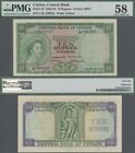 Ceylon: Central Bank of Ceylon 10 Rupees 1954, P.55, great condition without pinholes, just lightly toned paper and soft bend at center, PMG graded 58...
