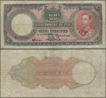 Fiji: Government of Fiji 1 Pound 1940, P.39c, minor margin splits, stained paper and several folds. Condition: F
 [taxed under margin system]