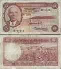 Malawi: Reserve Bank of Malawi 10 Shillings L.1964, P.2, lightly stained paper with several folds. Condition: F
 [taxed under margin system]