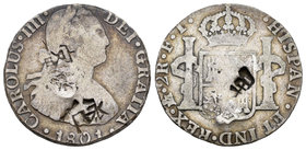 Carlos IV (1788-1808). 2 reales. 1801. México. FT. (Cal-996). Ag. 5,18 g. Resellos orientales. BC+. Est...50,00.
