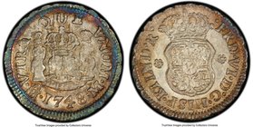 Ferdinand VI 1/2 Real 1748 Mo-M AU58 PCGS, Mexico City mint, KM67.1. Wreathed in a bright ring of sapphire coloration along the obverse rims, bleeding...
