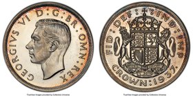 George VI Proof Crown 1937 PR65+ PCGS, KM857. Deep watery fields in contrast to the raised white devices, red and orange peripheral toning. 

HID09801...