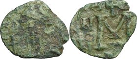 Lombardic Italy. Aistulf (749-756). AE Follis, Ravenna mint, struck 751-752 AD. D/ [D]N AI[...]. Traces of facing bust, draped and bearded, holding gl...