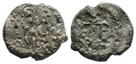 Lead seal of Petros Ostiarios (?) (7th cent.)
Obverse: The Mother of God, facial, full-size, holding infant Jesus Christ on her chest, between two cro...