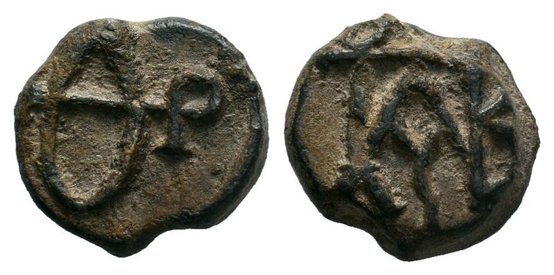 Byzantine lead seal of Theodoros patrikios
(6th/7th cent.)

Obverse: Letters Θ a...