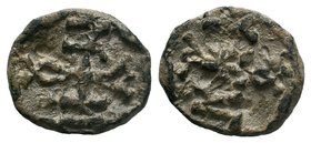Byzantine lead seal of Naoum chartoularios 
(6th/7th cent.)

Obverse: Cruciform monogram, reading as: ΝΑΟΥΜ = Ναοὺμ (Of Naoum).

Reverse: Cruciform mo...