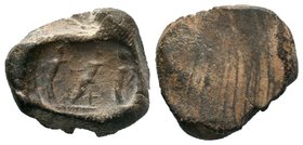 Ancient Rome, c. 1st-2nd century AD. Nice bulla depicting a seated figure, 2 standing figures at either side. Fingerprints of the maker on edges! 21 m...