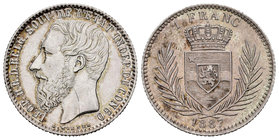 Congo Belge. Leopold III. 1 franco. 1887. (Dupriez-25). (Km-6). Ag. 5,00 g. Raya en anverso. Atractiva. Rara. Almost UNC. Est...250,00.