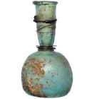 ROMA. Botella con irisaciones (s. II-III d.C.). Vidrio. Decorado con anillos metálicos. Altura 8,5 cm.