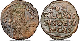 Theophilus (AD 829-842). AE follis (27mm, 6h). NGC Choice XF. Constantinople. ΘEOFIL'-bASIL', three-quarter length figure of Theophilus standing facin...