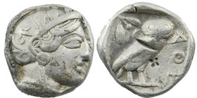 Attica, Athens AR Tetradrachm after 449 BC. 
Helmeted head of Athena right 
AΘE, owl standing right; olive-sprig and crescent above. 
SNG Cop 39. ...
