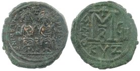 JUSTIN II (565-578). Follis. Kyzikos.
D N IVSTINVS P P AVC.
Justin, holding globus cruciger, and Sophia, holding cruciform sceptre, seated facing on...