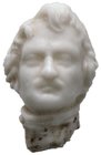 Rundplastisches Köpfchen. 1. Hälfte 19. Jahrhundert. Kopf König Ludwig I. von Bayern (1825-1848). Weiße Glaspaste. 10 x 15 mm
Klebereste am unteren Ab...