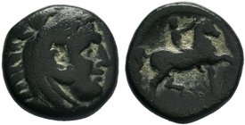 Macedonian Kingdom. Philip II. 359-336 B.C. AE unit . Head of young Herakles right, wearing lion skin headdress / ΦΙΛΙΠΠΟΥ, youth brandishing whip on ...