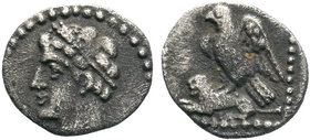 CILICIA. Uncertain. Obol (4th century BC). Obv: Youthful male head left, wearing wreath. Rev: Eagle standing left, wings spread, on the back of a lion...