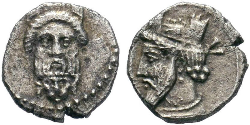 Cilicia, Uncertain mint AR Obol. 4th century BC. Bearded head facing, wearing ka...