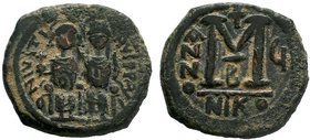 BYZANTINE.Justin II & Sophia AE Half Follis. 565-578 AD. Nicomedia mint. D N IVSTINVS P P AVG, Justin II on left, Sophia on right, seated facing on do...