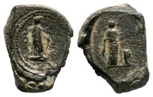 A large and heavy Roman iconographic lead seal!

Condition: Well centered, VF. Nice natural patina.

Obverse: A standing figure to right, holding pate...