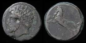 NUMIDIA: Massinissa or Micipsa (203-148 BCE) AE26. 15.10g, 26mm.
Obv: Laureate and bearded head to left. 
Rev: Horse galloping left; below, pellet. ...