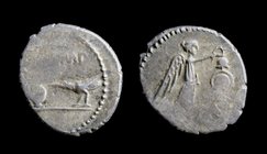 Mark Antony, AR quinarius, issued 43-42 BCE. 1.83g, 15mm.
Obv: Lituus, capis, and raven standing left on ground line; M ANT(ligate) IMP above 
Rev: ...
